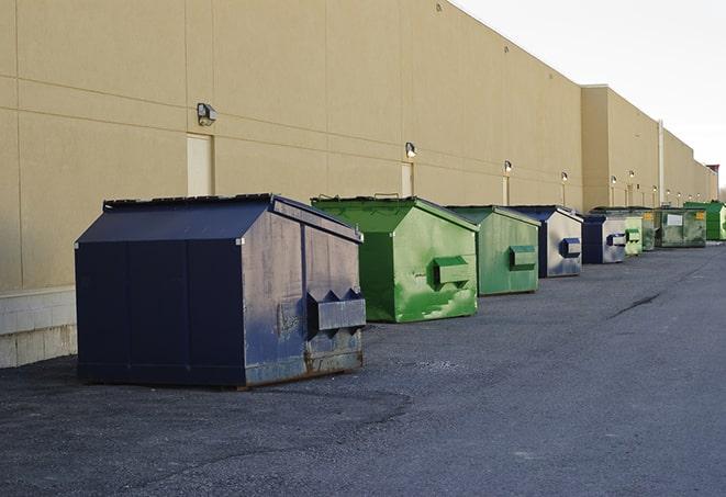 a row of industrial dumpsters at a construction site in Butler, WI